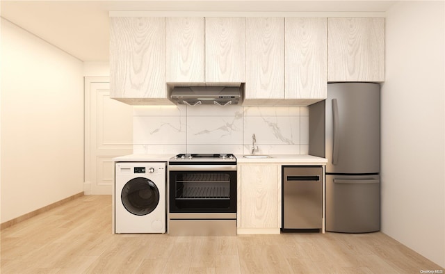 136-80 41st Ave Unit 6G, Flushing, NY 11355 - kitchen with washer / dryer, range with electric stovetop, wall chimney exhaust hood, freestanding refrigerator, and tasteful backsplash