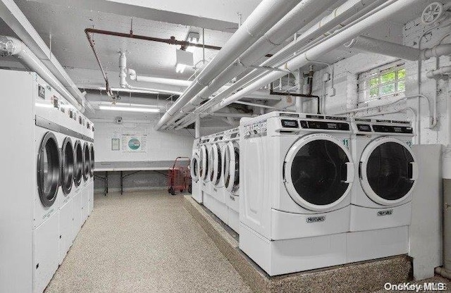 laundry room with washing machine and clothes dryer