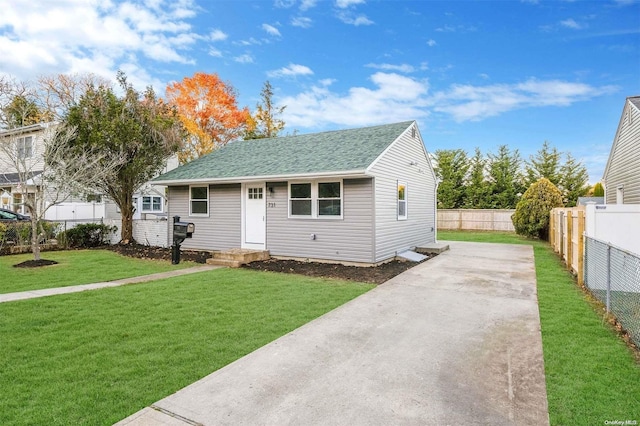 bungalow-style home featuring a front lawn