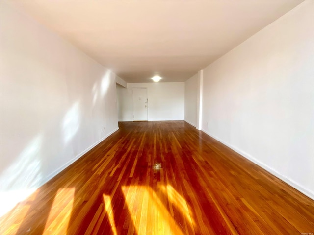 empty room featuring hardwood / wood-style flooring