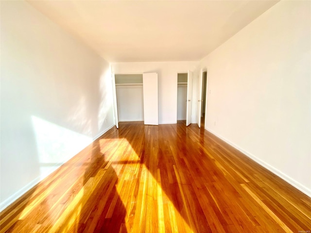 unfurnished bedroom featuring hardwood / wood-style floors