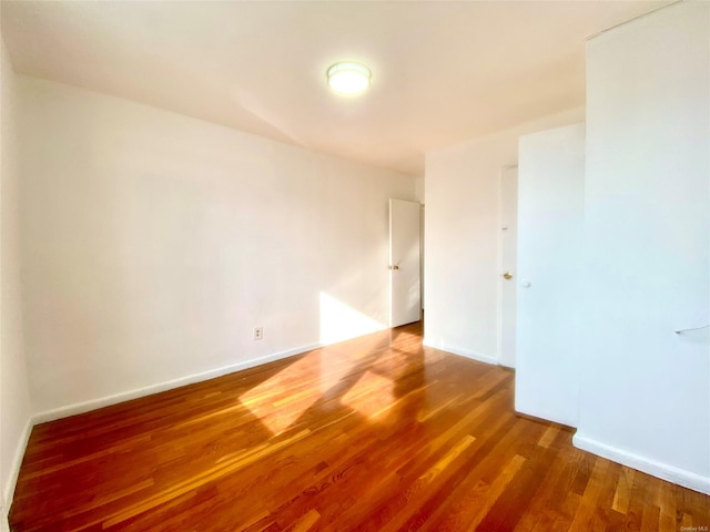 spare room featuring hardwood / wood-style floors