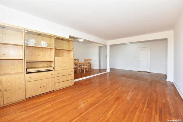 unfurnished living room featuring hardwood / wood-style floors