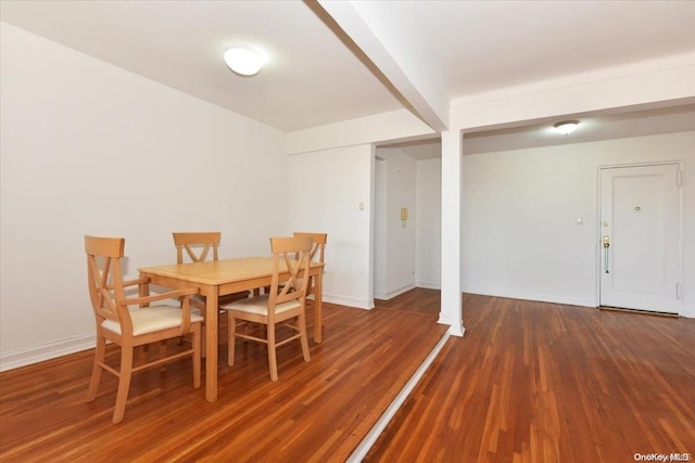 dining space featuring dark hardwood / wood-style flooring