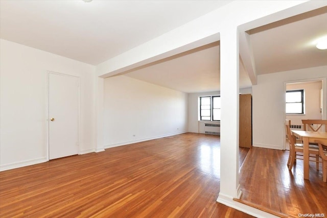 interior space featuring hardwood / wood-style flooring and radiator