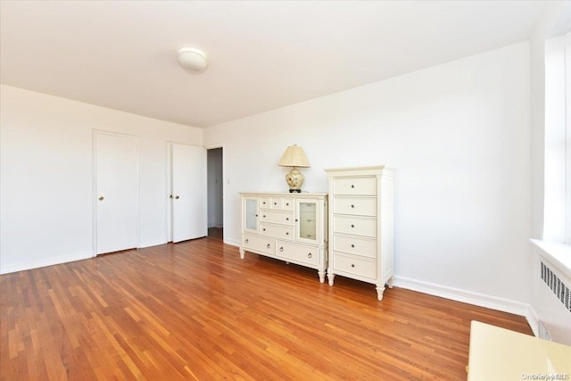 unfurnished bedroom featuring hardwood / wood-style floors