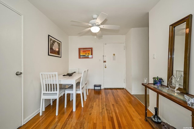 dining room featuring ceiling fan and wood-type flooring