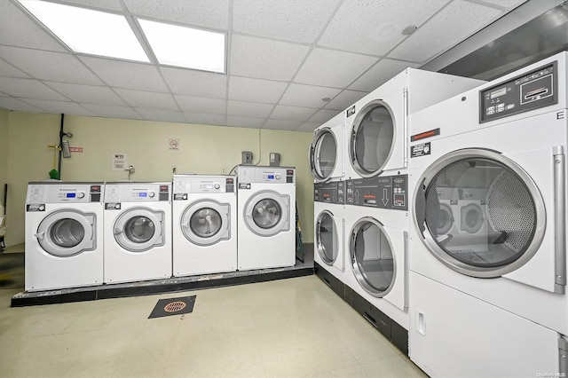 clothes washing area featuring stacked washer and clothes dryer and independent washer and dryer