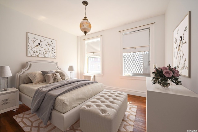 bedroom with dark hardwood / wood-style floors