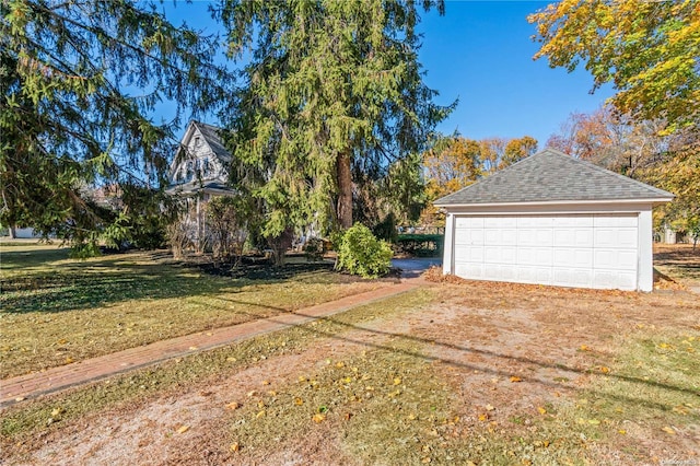 garage with a lawn