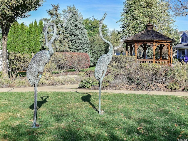 surrounding community featuring a gazebo and a yard