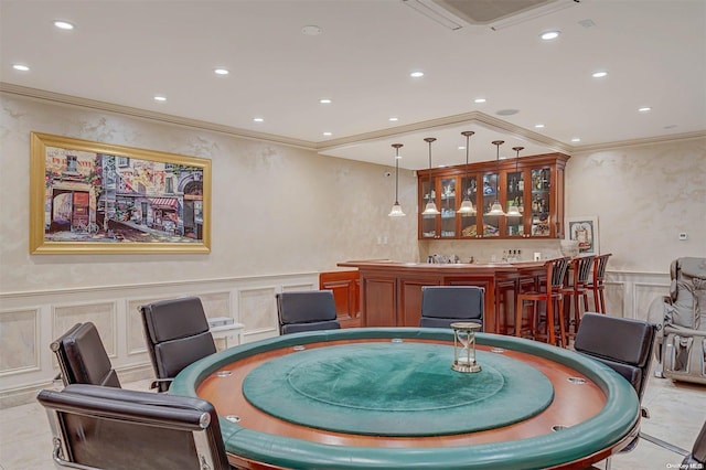 tiled dining space with bar area and ornamental molding