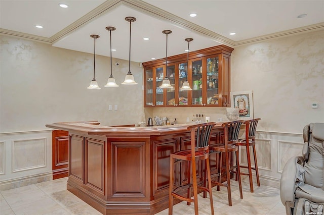 bar featuring crown molding, light tile patterned flooring, and decorative light fixtures