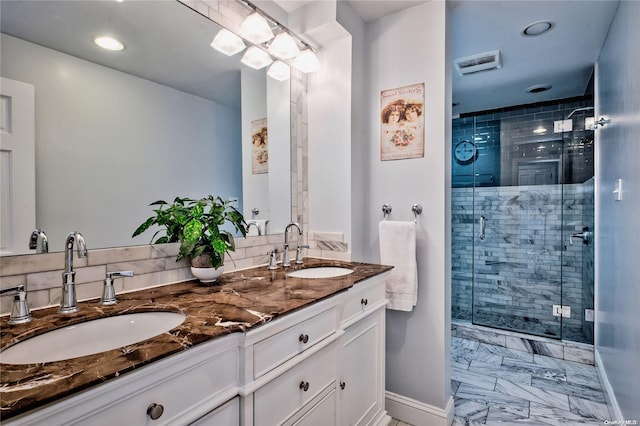 bathroom featuring vanity and a shower with shower door