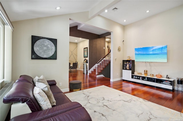 living room with lofted ceiling with beams and dark wood-type flooring