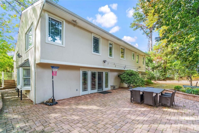 rear view of property with a patio area