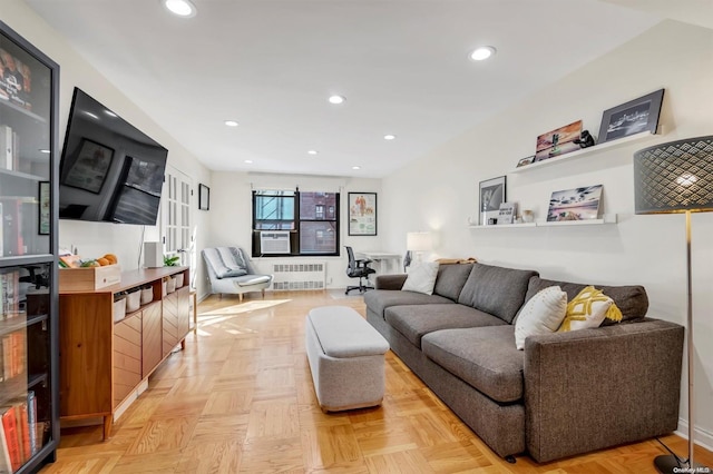 living room featuring french doors, light parquet floors, and radiator