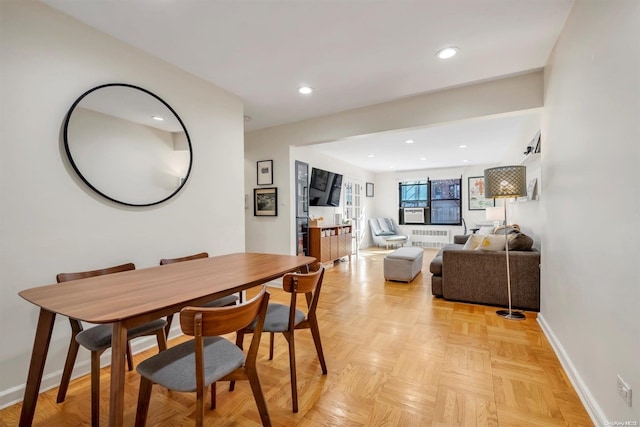 dining area featuring light parquet floors