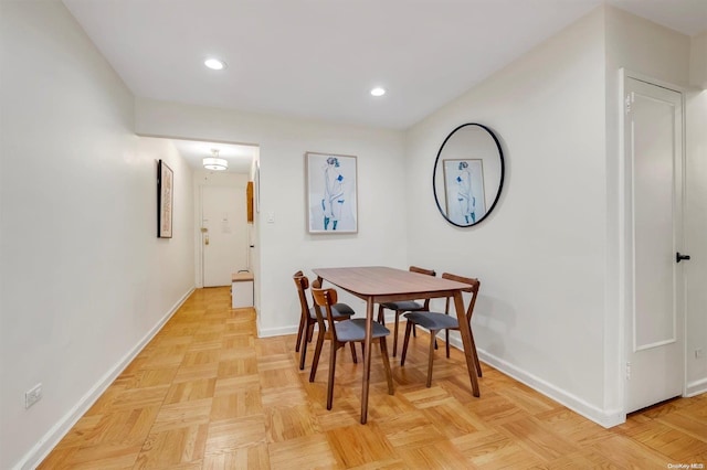 dining space with light parquet floors