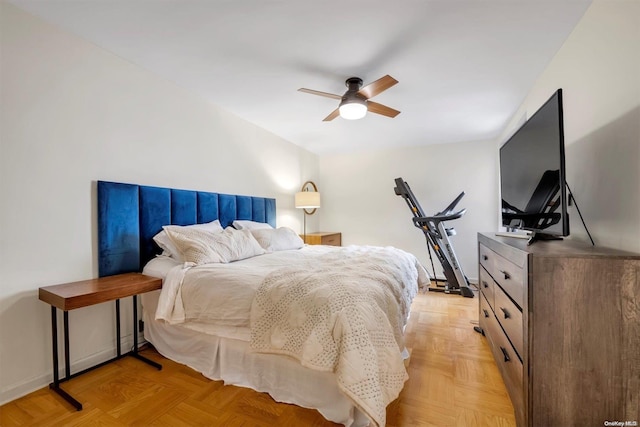 bedroom with ceiling fan and light parquet floors