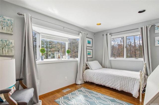 bedroom featuring wood-type flooring