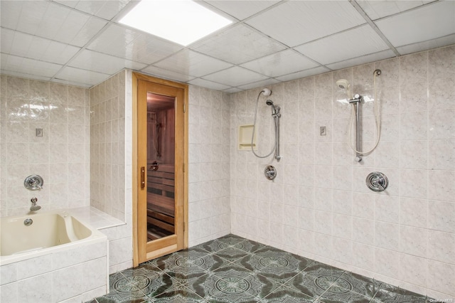 bathroom with tile patterned floors and tiled shower / bath combo