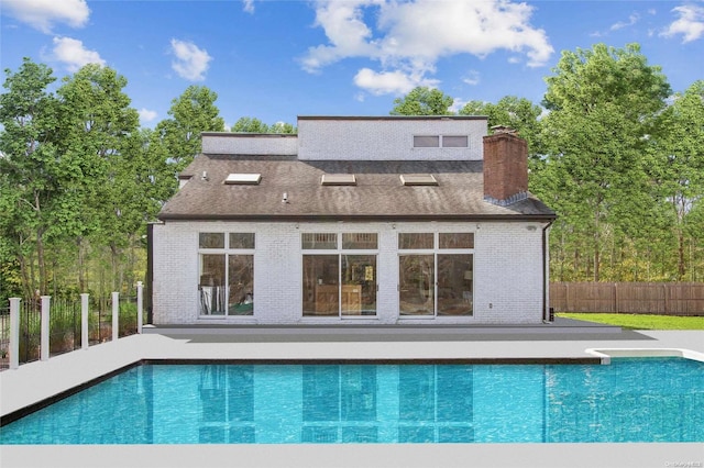 view of swimming pool with a diving board