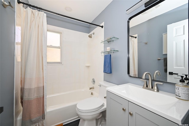 full bathroom with shower / bath combo with shower curtain, vanity, and toilet