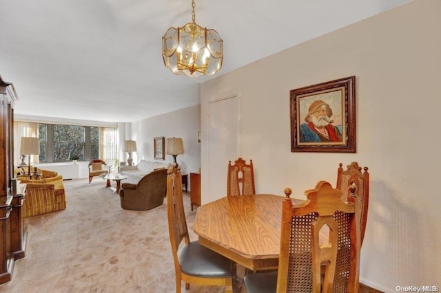 18-75 Corporal Kennedy St Unit 2F, Bayside, NY 11360 - dining space featuring a chandelier and light colored carpet