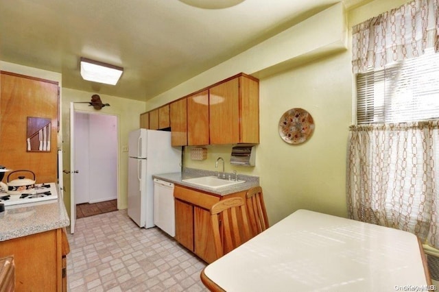 18-75 Corporal Kennedy St Unit 2F, Bayside, NY 11360 - kitchen featuring a sink, white appliances, light countertops, and brown cabinetry