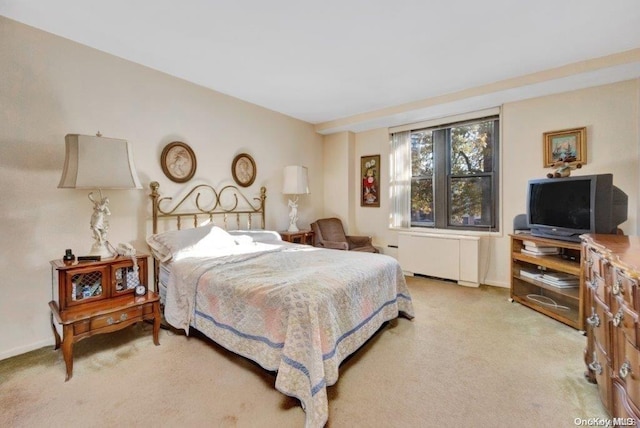 18-75 Corporal Kennedy St Unit 2F, Bayside, NY 11360 - bedroom with light carpet and radiator