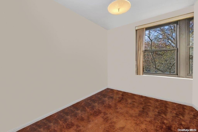 18-75 Corporal Kennedy St Unit 2F, Bayside, NY 11360 - unfurnished room with dark carpet and baseboards