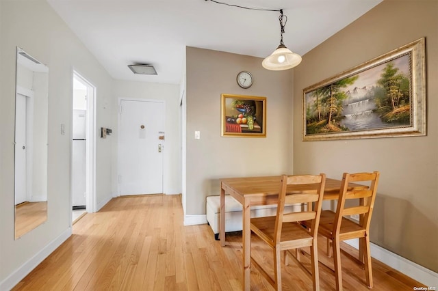 dining room featuring light wood-type flooring