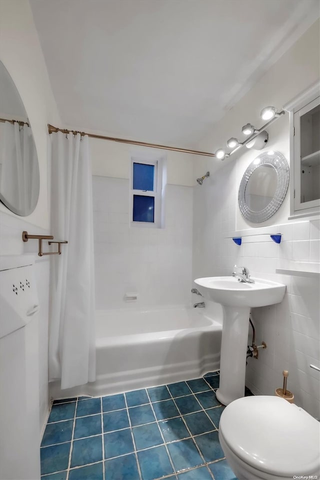 bathroom with tile patterned flooring, toilet, tile walls, and shower / tub combo with curtain