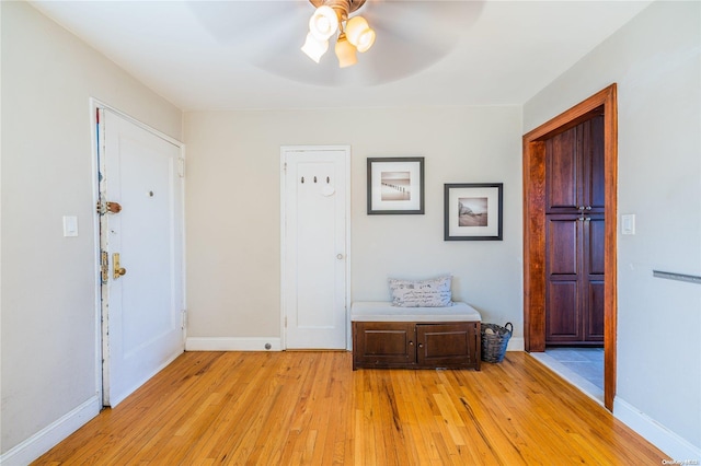 entryway with ceiling fan and light hardwood / wood-style flooring