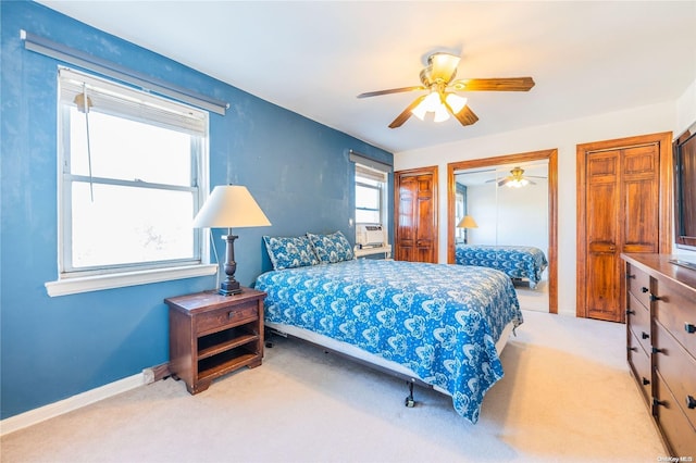 carpeted bedroom with ceiling fan and cooling unit