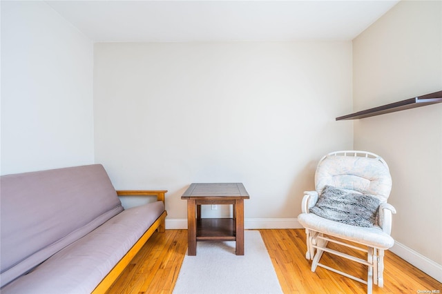 sitting room with light hardwood / wood-style flooring