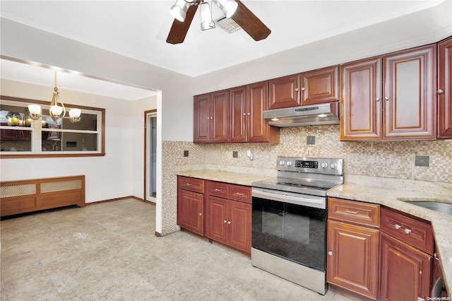 kitchen with decorative backsplash, light stone countertops, stainless steel range with electric stovetop, ceiling fan with notable chandelier, and hanging light fixtures