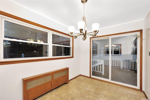 interior space featuring a chandelier and ornamental molding