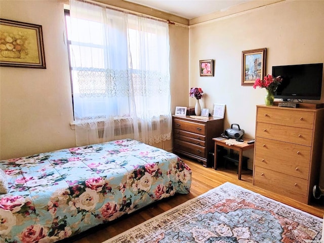 bedroom featuring hardwood / wood-style floors