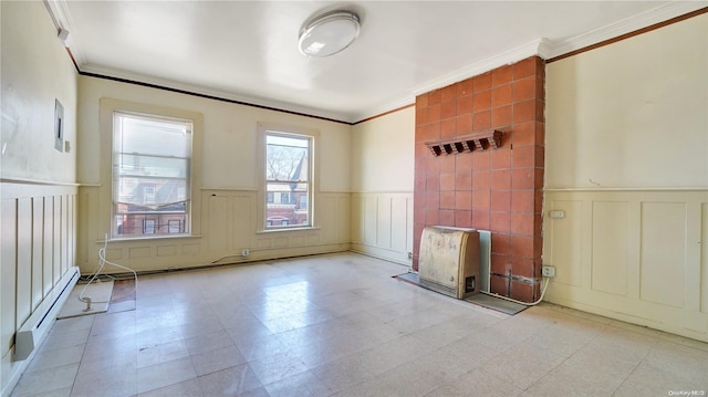 spare room featuring a baseboard radiator and ornamental molding