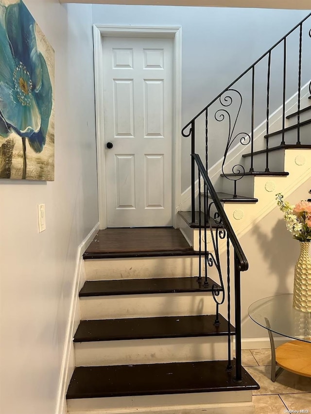 136 Acorn Ave, Central Islip, NY 11722 - stairs featuring baseboards and tile patterned flooring