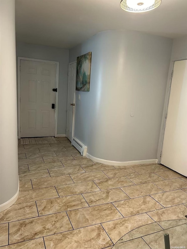 136 Acorn Ave, Central Islip, NY 11722 - foyer entrance featuring a baseboard heating unit and baseboards