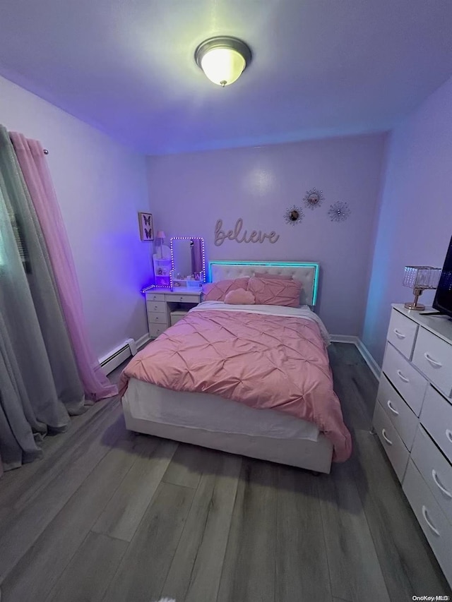 bedroom with dark hardwood / wood-style floors