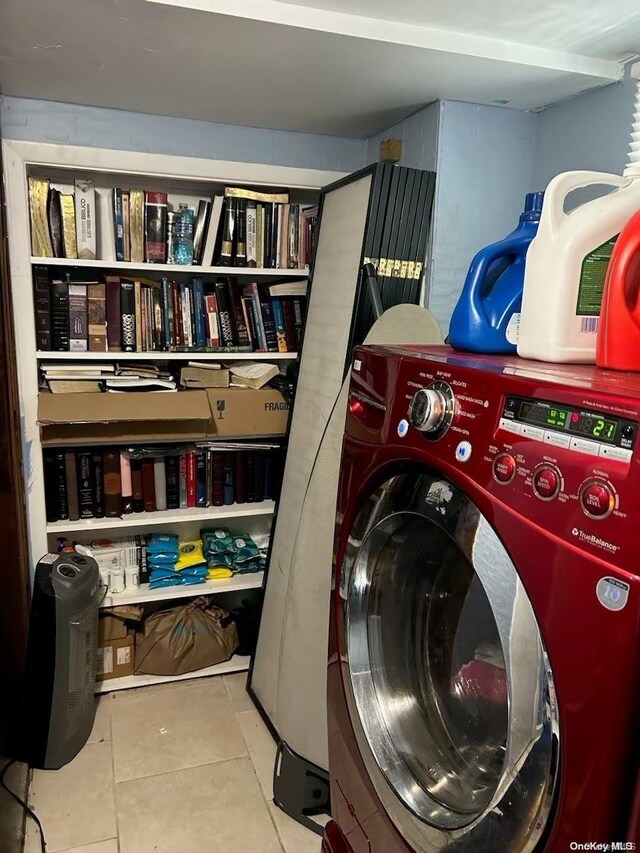 136 Acorn Ave, Central Islip, NY 11722 - laundry room with washer / clothes dryer and tile patterned floors