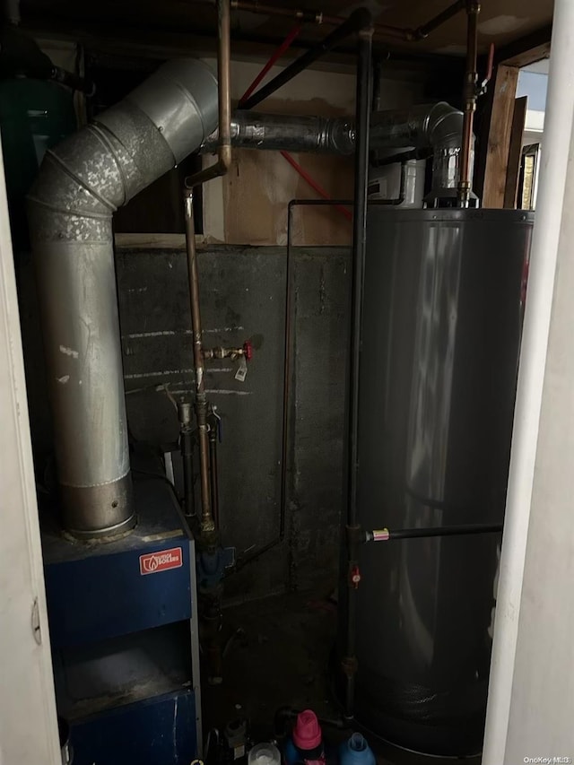 utility room with water heater