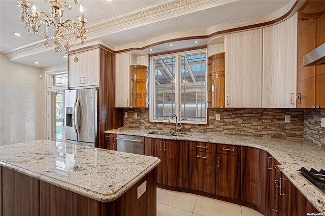 kitchen featuring light tile patterned flooring, light stone counters, appliances with stainless steel finishes, and tasteful backsplash