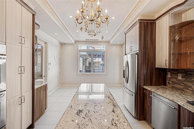 kitchen featuring light tile patterned flooring, light stone countertops, crown molding, and appliances with stainless steel finishes