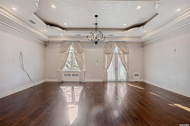 unfurnished room featuring french doors, dark hardwood / wood-style floors, a raised ceiling, and crown molding