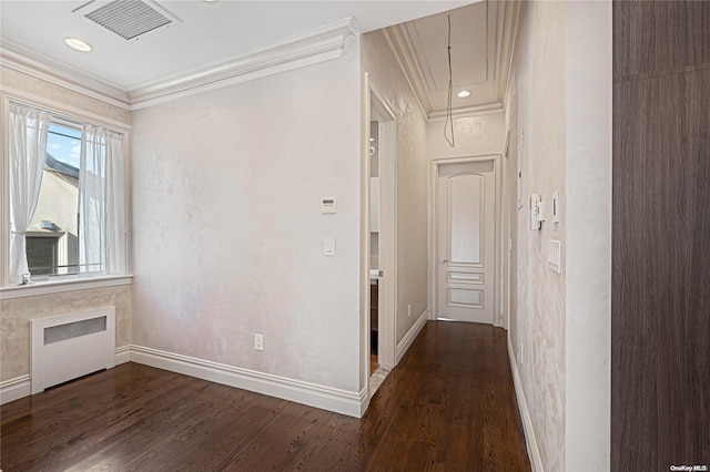 hall with crown molding, radiator, and dark wood-type flooring